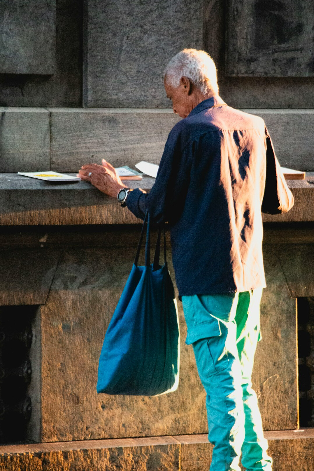 elderly man reading book