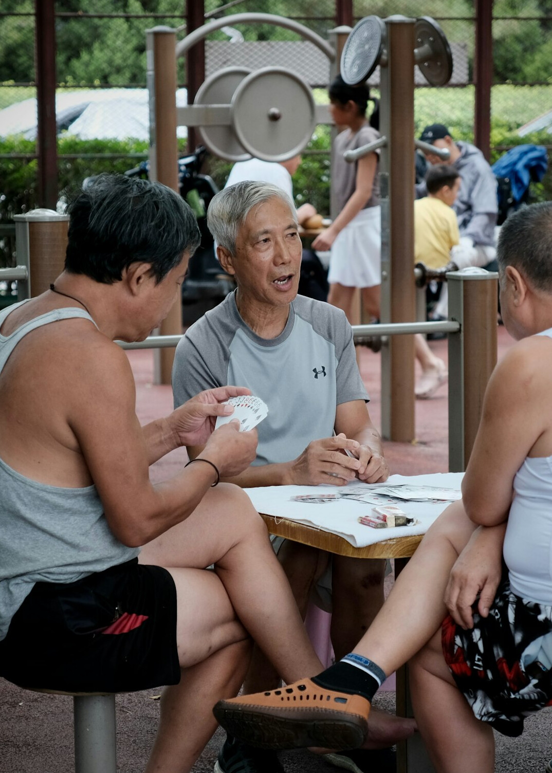 elderly people exercising outdoors